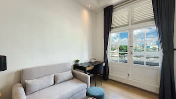 Apartment, 1 Queen Bed with Sofa bed, Balcony, City View | Living area | 48-inch Smart TV with digital channels