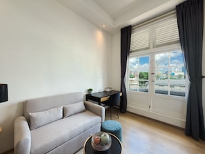 Apartment, 1 Queen Bed with Sofa bed, Balcony, City View | Living area | 48-inch Smart TV with digital channels - The White House Serviced Residences (Singapore)