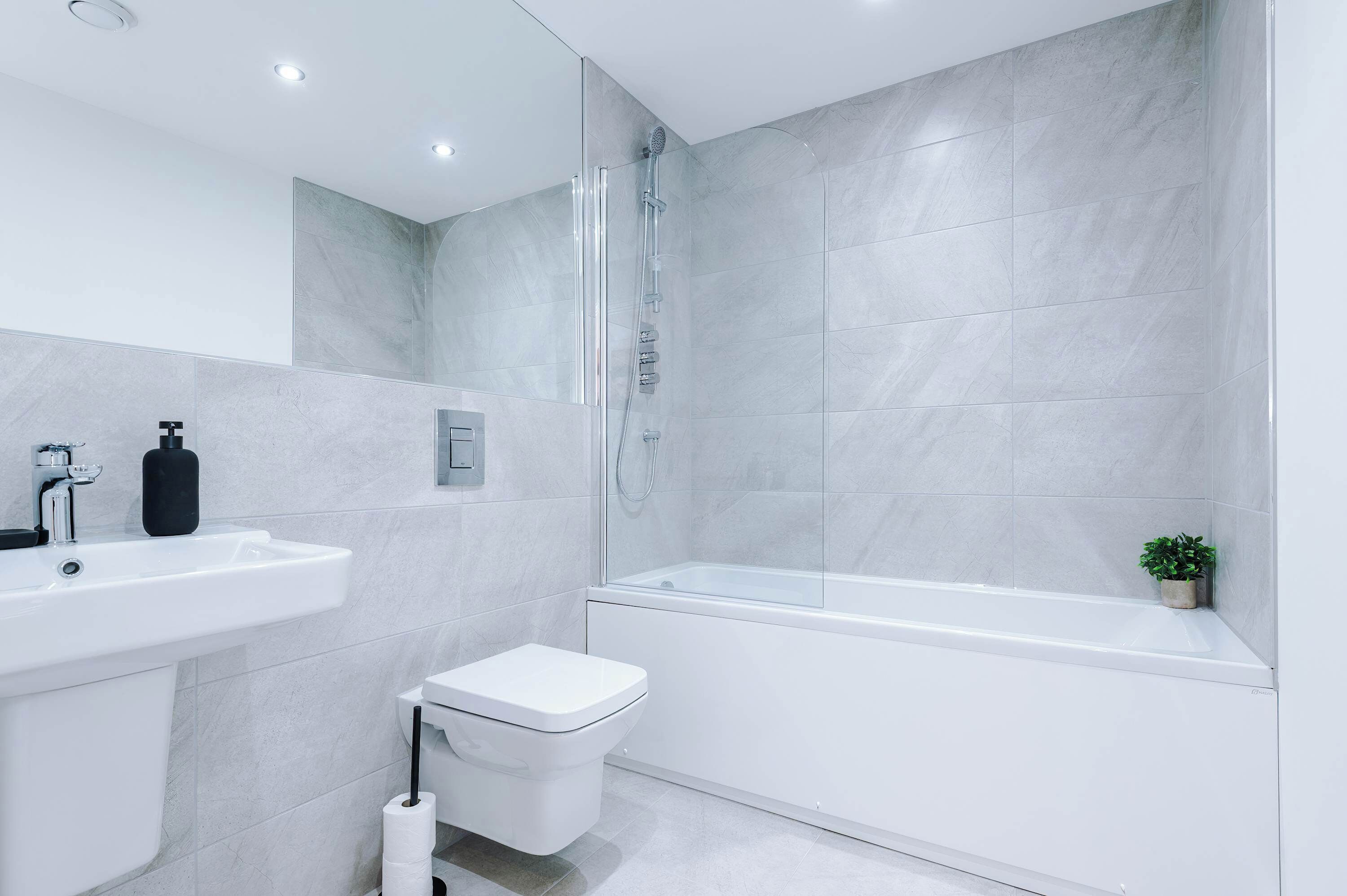 Enjoy a bright, fresh space with modern fittings, ideal for unwinding after work or starting the day feeling refreshed.