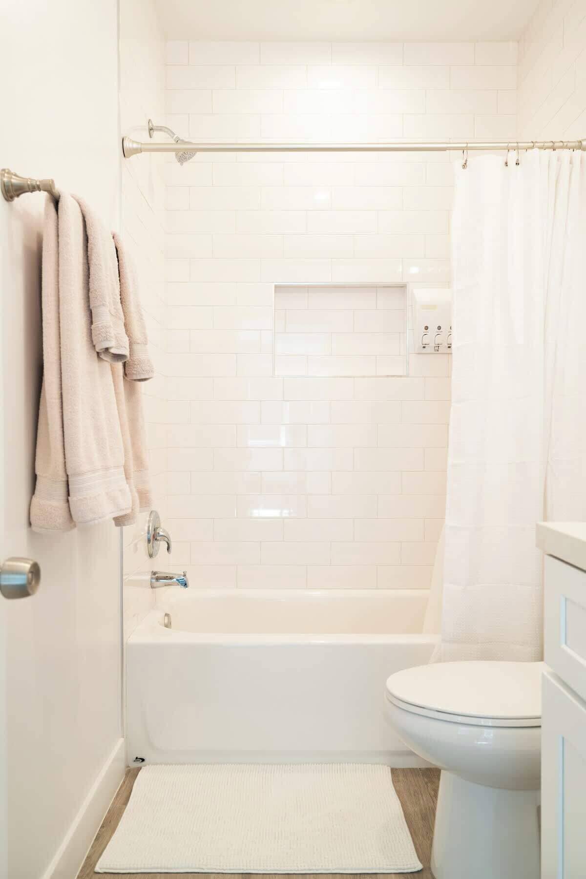 Shower, hair dryer, towels, shampoo