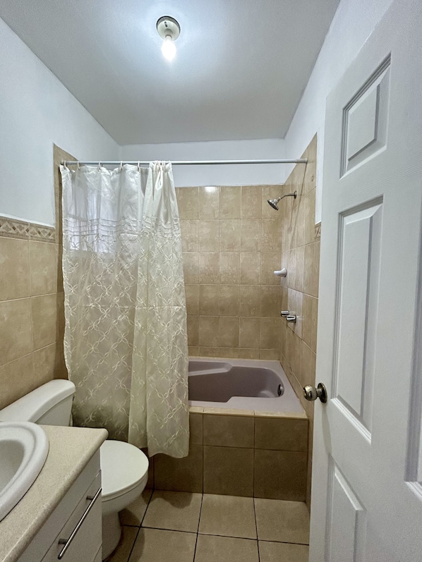 Shower, towels, soap, toilet paper