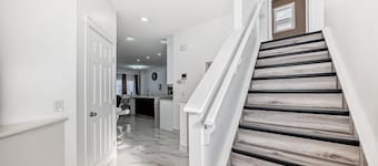 Luxury 4 Bedroom detached, vacation home in SW Calgary. King-size bed.