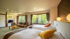 A hotel room with two beds, a sofa, a small table, and a TV. - KKR Zao Hakuginso (Yamagata)