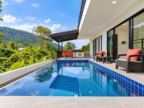 A modern pool area with a clear view of the surrounding greenery and hills. - Brand New Private pool villa Chalong Phuket Mountain view (Tambon Chalong)