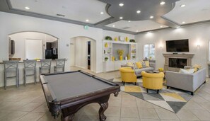 A modern hotel lobby with a pool table, seating area, and a TV mounted on the wall. - 1 Bedroom Paradise - Marina Del Rey (Marina del Rey)