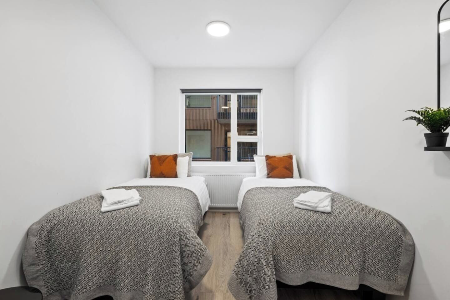 Bedroom with two comfortable beds 🛏️, fresh sheets & pillows, and your own clothing storage 🧺