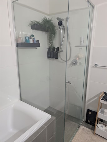 Hair dryer, bidet, towels, soap. Seamless Comfort: Guest Room in Shared Modern Apartment