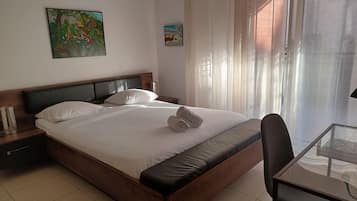 1 bedroom, desk, iron/ironing board, travel crib