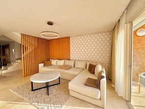 Living area - Le Romarin with pool view and beach access at Taghazout Bay (Tamraght)