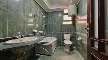 Separate bathtub and shower, hair dryer, slippers, towels