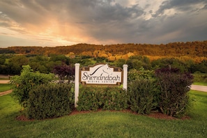 A sign for Shenandoah Riding Center surrounded by lush greenery and a forested hill in the background. - New Construction - All En Suites!  Hot Tub, Fireplace, Screened Porch & MORE! (Galena)