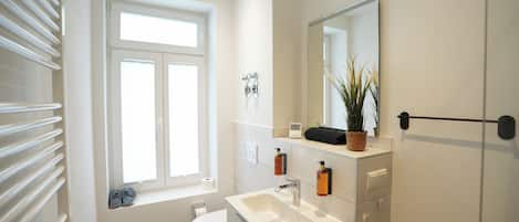 Shower, eco-friendly toiletries, hair dryer, towels