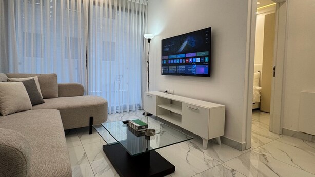 Living room - Boulevard Comfort Haven, apt With Stunning Veiw (Amman)