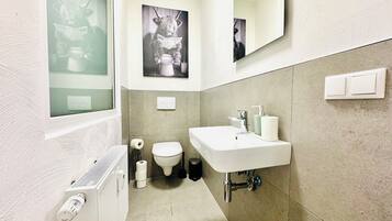 Shower, eco-friendly toiletries, hair dryer, towels