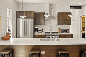 Fridge, microwave, oven, stovetop - Highlands Square Modern 3BR – Yard, Grill & Garage (Denver)