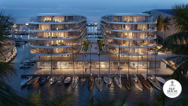 A waterfront hotel with multiple balconies, a marina with boats, and a modern architectural design. - Waterfront Porto Antico House (Genoa)