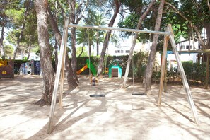 Children's area - APARTAMENTOS CLUB CALA AZUL  (Santa Eulalia del Rio)