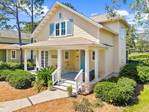 A two-story house with a porch, a small front yard, and a mailbox. - Resort Living: 2 Golf Carts + Pets Welcome (Miramar Beach)