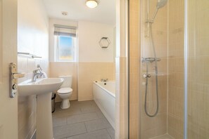 Shower, hair dryer, towels, soap