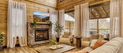 Gather in the bright, open living room where modern touches meet mountain comfort