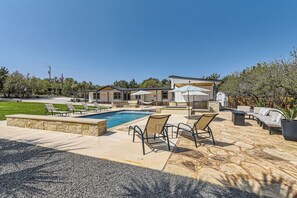 Outdoor pool, a heated pool - The Palm Hideaway Oasis with Pool + Hot Tub + Fire pit & Outdoor kitchen! (Spicewood)