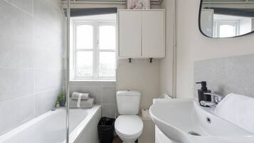 Shower, towels, soap, toilet paper