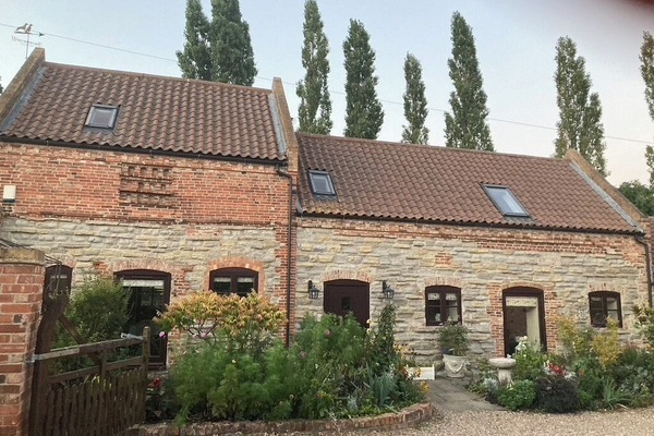 Beautiful Cottage surrounded by flowers
