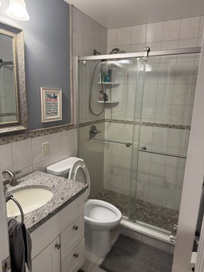 Shower, hair dryer, towels, soap