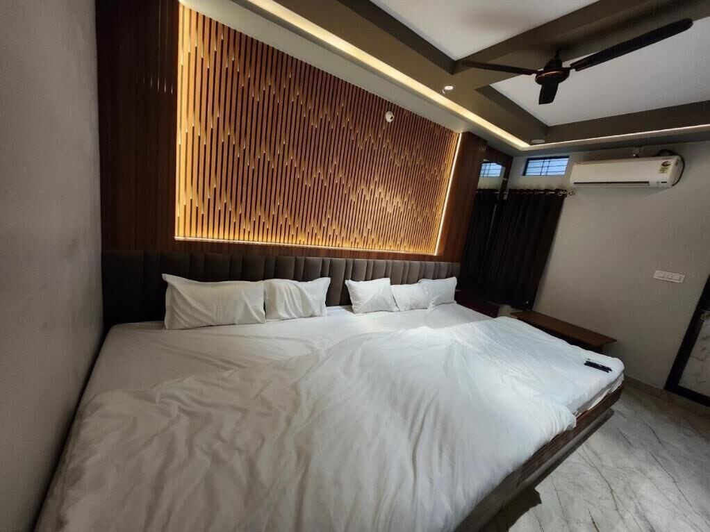 Deluxe Quadruple Room, City View | In-room safe, blackout curtains, soundproofing, free WiFi