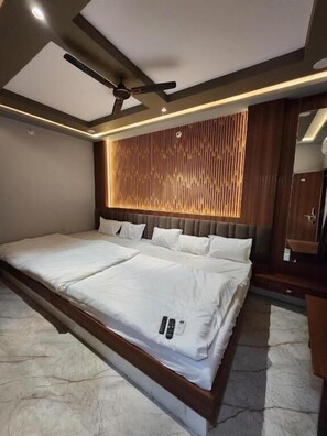 Deluxe Quadruple Room, City View | In-room safe, blackout drapes, soundproofing, free WiFi - Hotel Shree Sanwaliya (Ujjain)