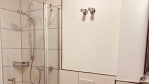 Shower, hair dryer, towels, toilet paper