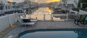 Pet friendly 3-bedroom house with saltwater heated pool. EV charger.