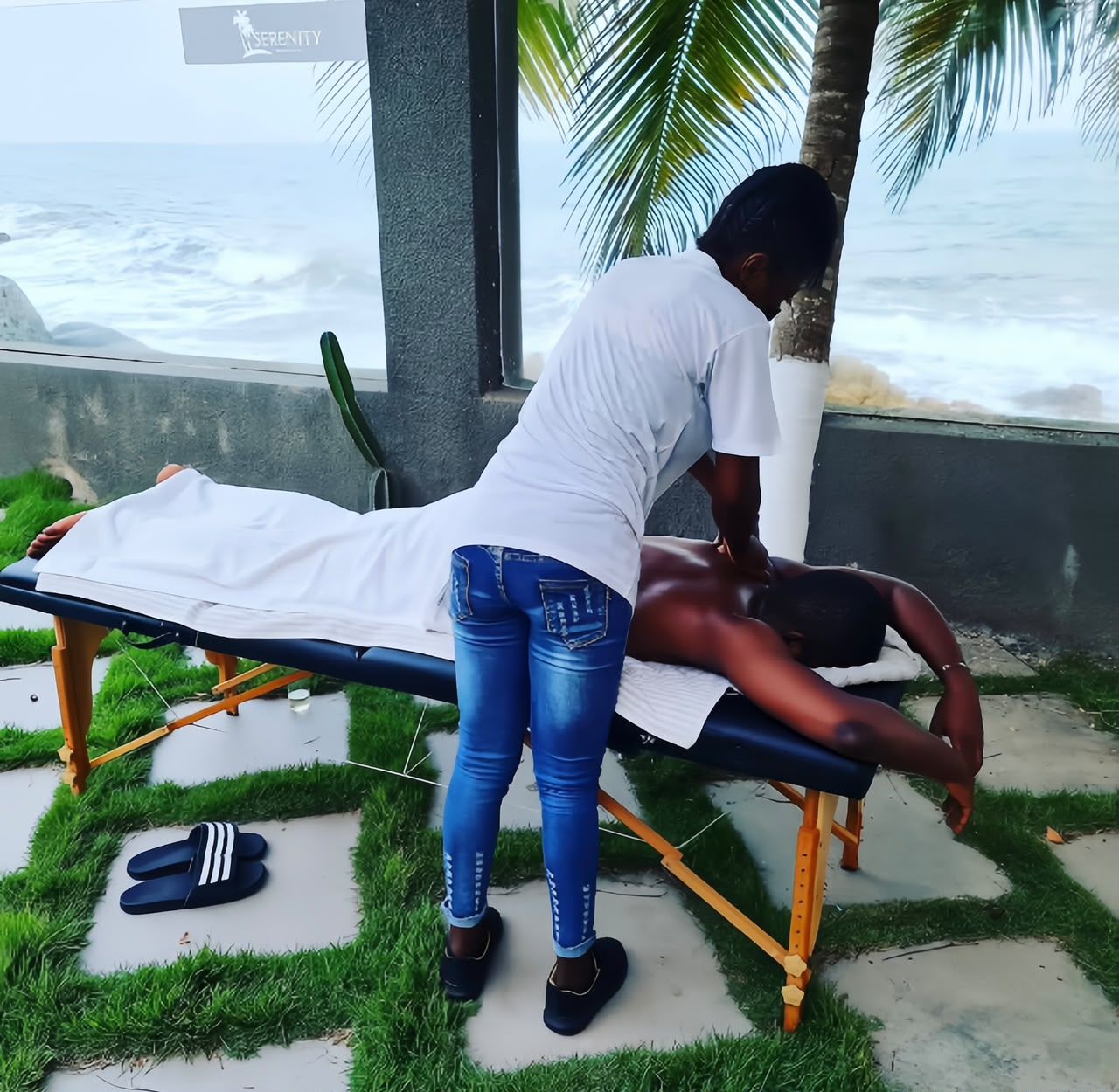 A massage table outdoors with a person receiving a massage.