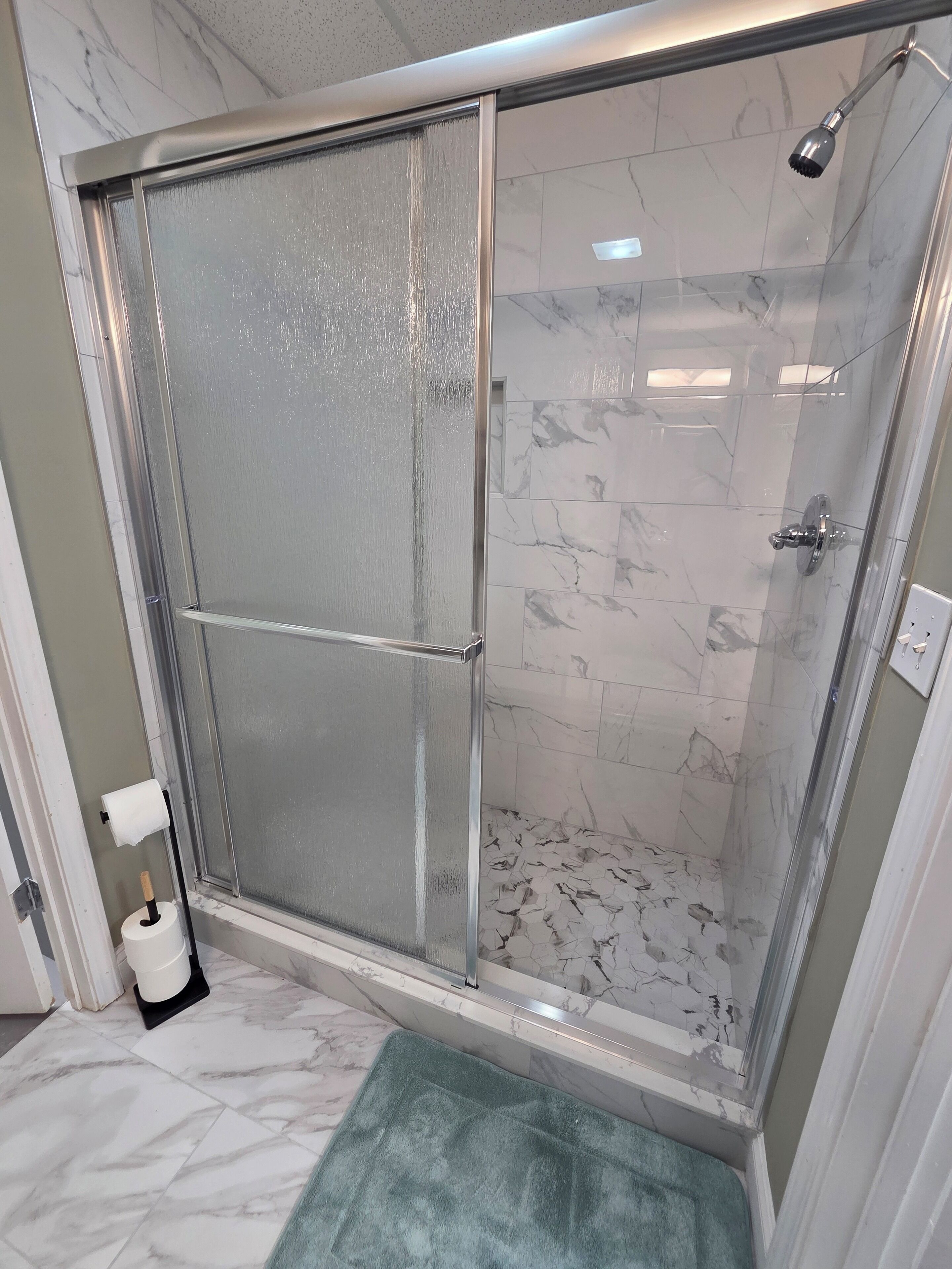 Shower, towels, soap, toilet paper