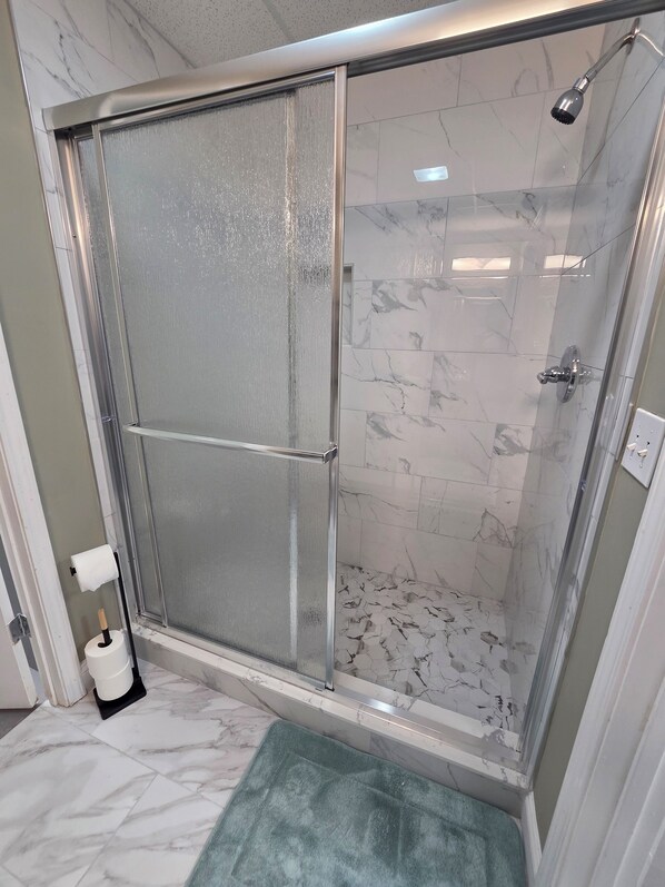 Shower, towels, soap, toilet paper