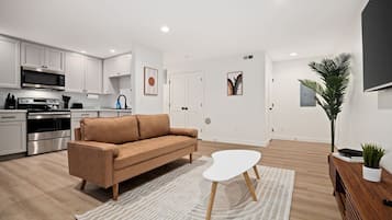 Apartment, Non Smoking | Living area | 42-inch flat-screen TV with cable channels