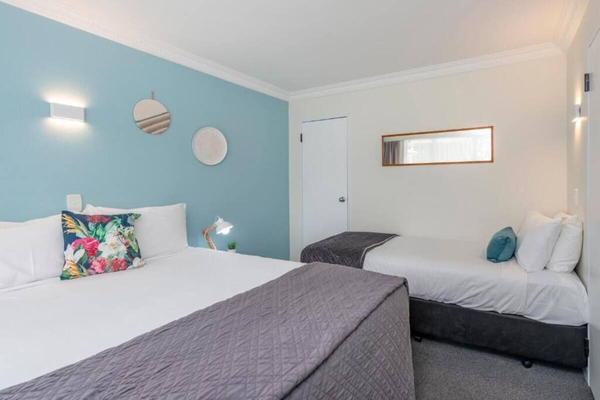 Family Apartment, Patio, Garden View | Desk, laptop workspace, blackout drapes, iron/ironing board