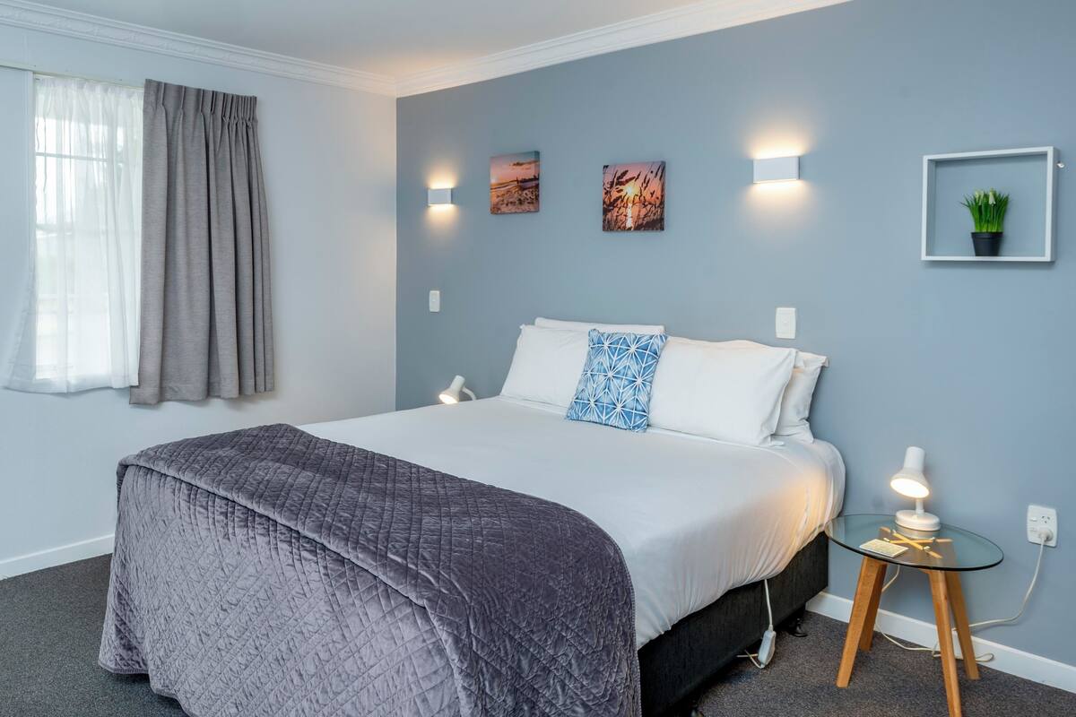 Studio, 1 Queen Bed, Patio, Garden View | Desk, laptop workspace, blackout drapes, iron/ironing board
