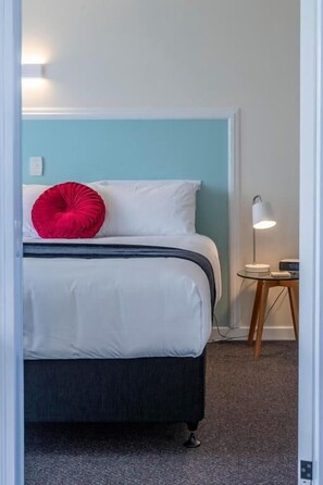 Executive Apartment, Patio, Garden View | Desk, laptop workspace, blackout drapes, iron/ironing board