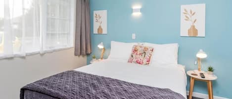 Desk, laptop workspace, blackout curtains, iron/ironing board