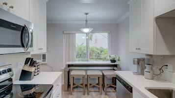 Coffee/tea maker, fridge, microwave, oven