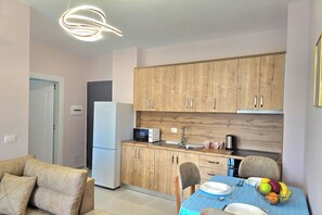 Family Apartment, Multiple Bedrooms (Happy Stay Apartment By The Sea 094) | Private kitchen | Fridge, microwave, oven, stovetop - Happy Stay Apartment By The Sea 094 (Golem)