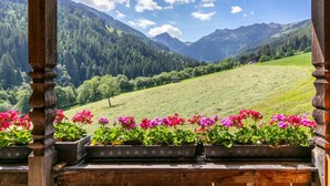 A wooden structure with a view of a mountainous landscape. - Two holiday apartments in farmhouse with a view (Alpbach)