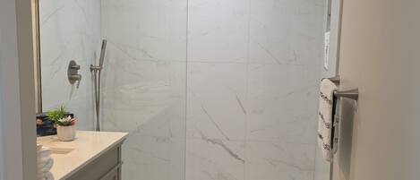 Shower, hair dryer, towels, soap