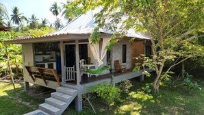 A house with a porch, a hammock, and a staircase leading to the entrance. - Island’s Gift – Private Design House for 2 Near Sunset Beach (Koh Phangan)