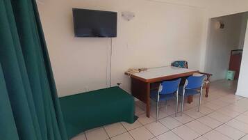 Desk, laptop workspace, blackout curtains, iron/ironing board