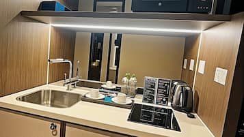 Economy Studio, Partial Ocean View | Private kitchen | Mini-fridge, microwave, stovetop, highchair