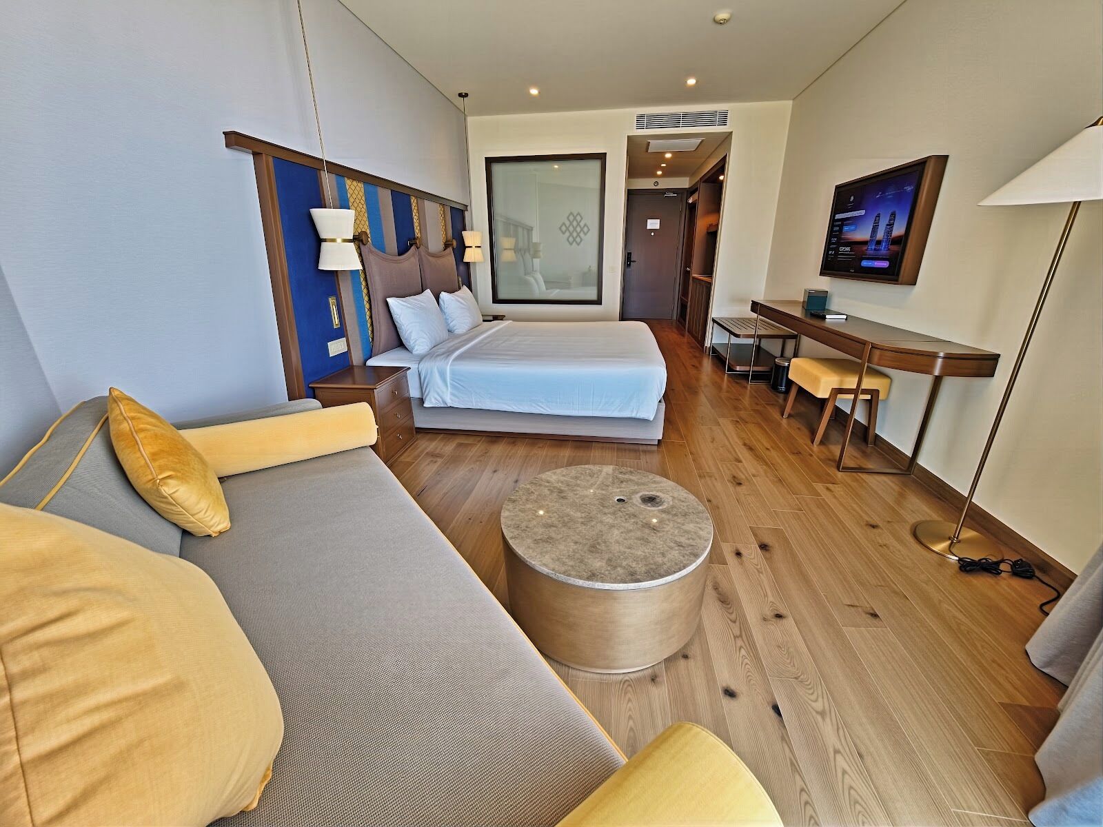 Grand Quadruple Room, Partial Ocean View | Premium bedding, pillow-top beds, free minibar items, in-room safe