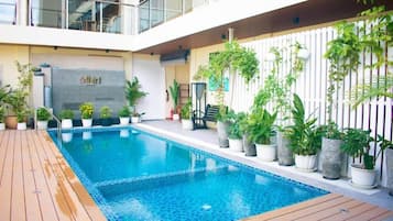 Indoor pool, open 8:00 AM to 8:00 PM, pool umbrellas, sun loungers