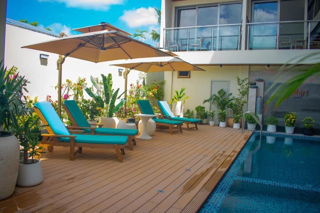 Indoor pool, open 8:00 AM to 8:00 PM, pool umbrellas, sun loungers